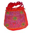 Fine fashion accessory distribution catalog exports Handcrafted womans handbag with emerald green designs on purple colored front of red bag and multi straps