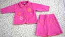 Kids wholesale shopping apparel factory. Childrens pink spring outfit with flower design on jacket style shirt and hearts on skirt